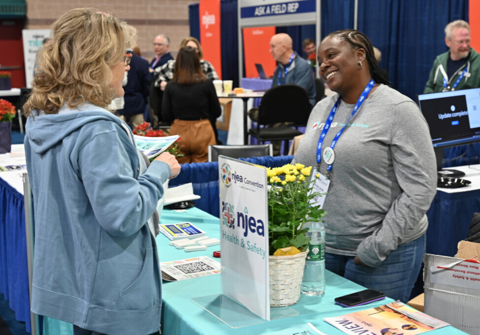 Madeleine Leach, Camden County’s representative to the NJEA Worksite Safety and Health Committee, speaks with Medford Education Association member Mary Mansfield at the 2025 NJEA Convention. 