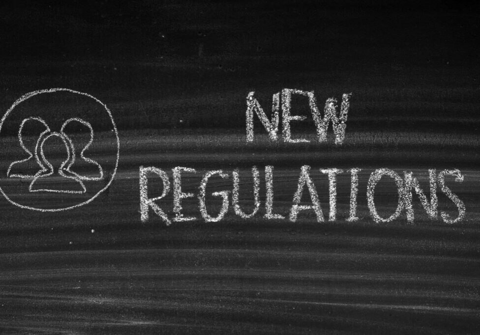 New Regulations chalk on blackboard