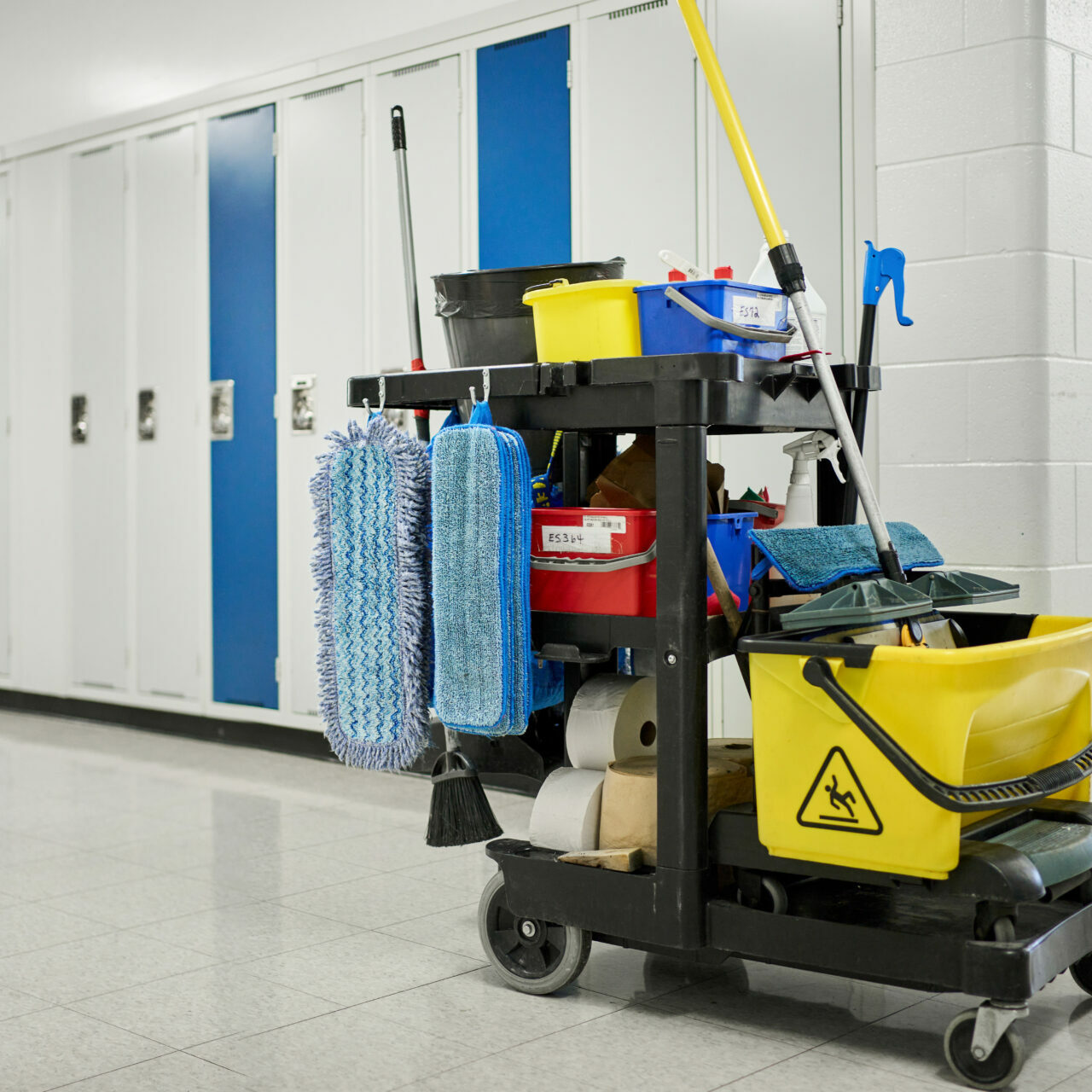 Custodial cart sitting in a school hallway