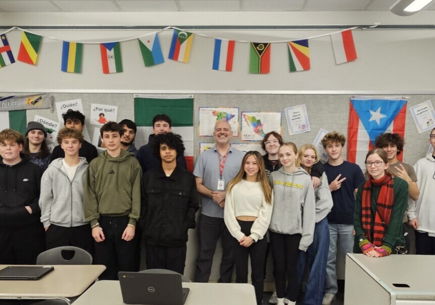 Hernandez poses with world language students at Hunterdon Central Regional High School. Hernandez believes that learning a world language is not a luxury. It is a critical skill that helps give students a global edge.  