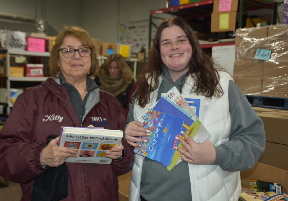 NJREA President Harriet “Kitty” Sausa and NJAEA President Madison Baca volunteer together at BookSmiles in Pennsauken. 