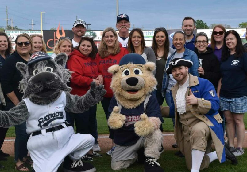 Somerset Patriots with teachers on the field
