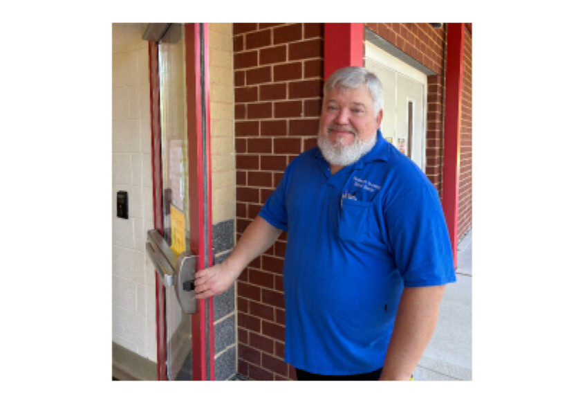 ESP member holding a door open